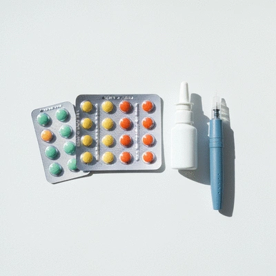Variety of migraine treatment options on a clean background, realistic product photography, no text, no words, no typography, clean image
